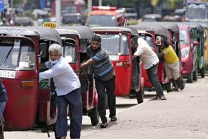 Sri Lanka's Parliament approves a debt restructuring plan in an attempt to overcome economic crisis.